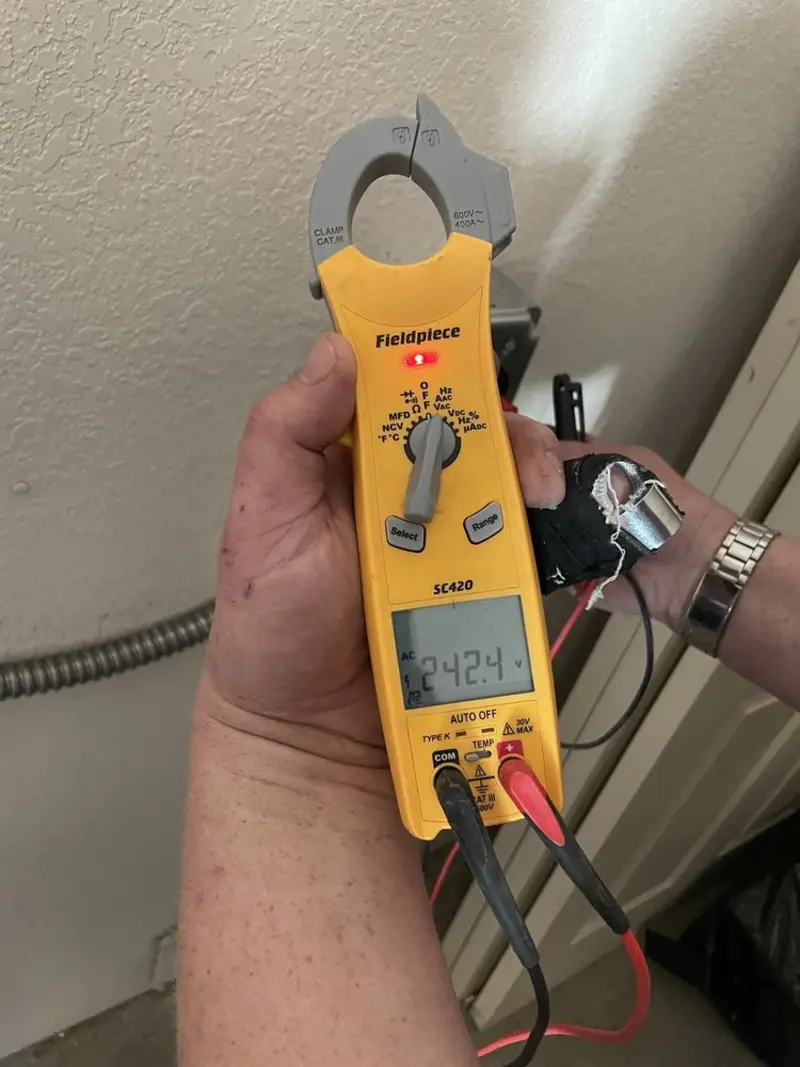 Voltage testing with clamp meter during Aluminum Wiring Replacement in Republic